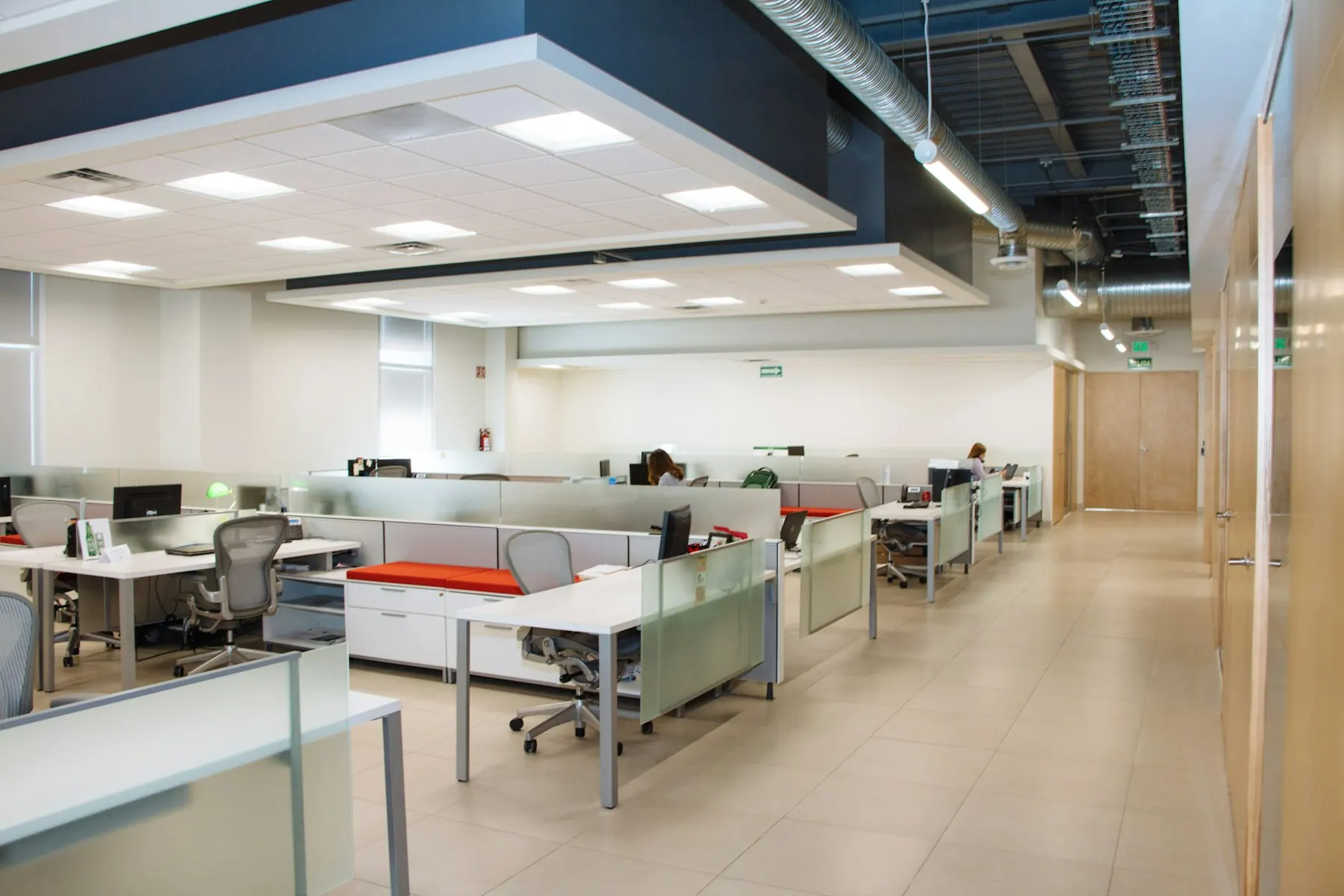 Bright open-plan office with white desks